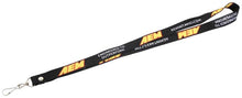 Load image into Gallery viewer, AEM Black Lanyard 3/4in x 36in w/ Swivel Clip - Red / Yellow AEM Logo